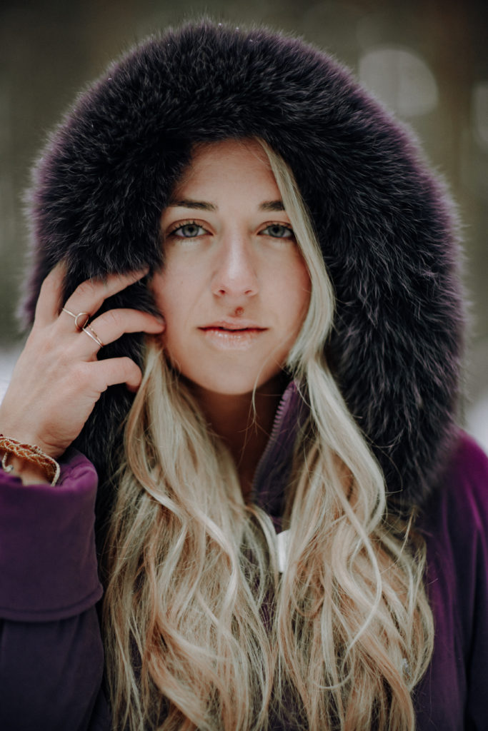 Singer/Songwriter Shay Wolf wearing hooded fur coat