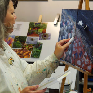 Gayle Halliwell working on a painting