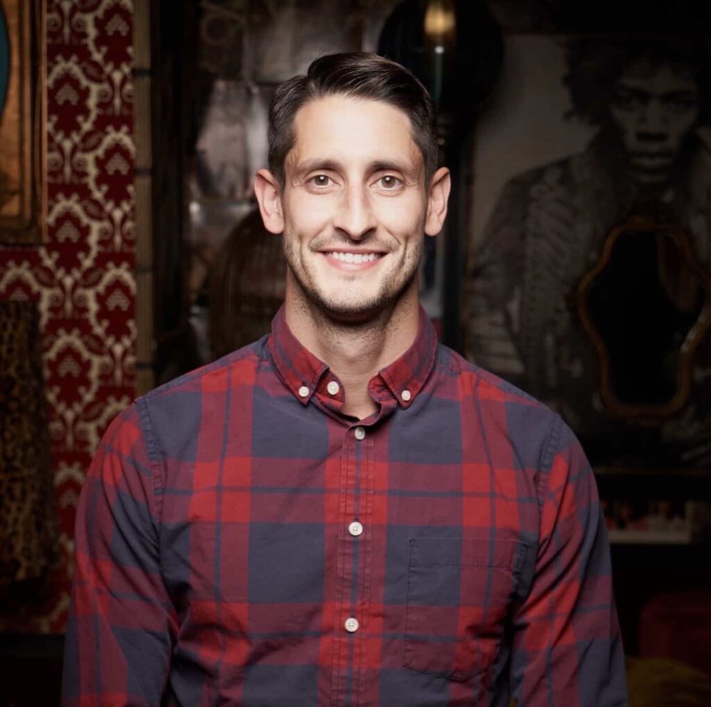 Man in plaid shirt facing camera