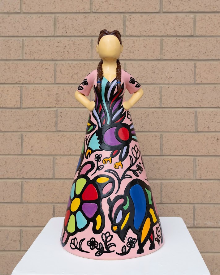 Ceramic sculpture of woman with patterned skirt