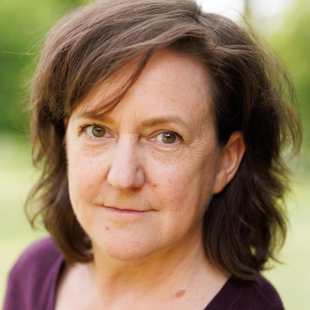 Photo of brunette woman facing camera