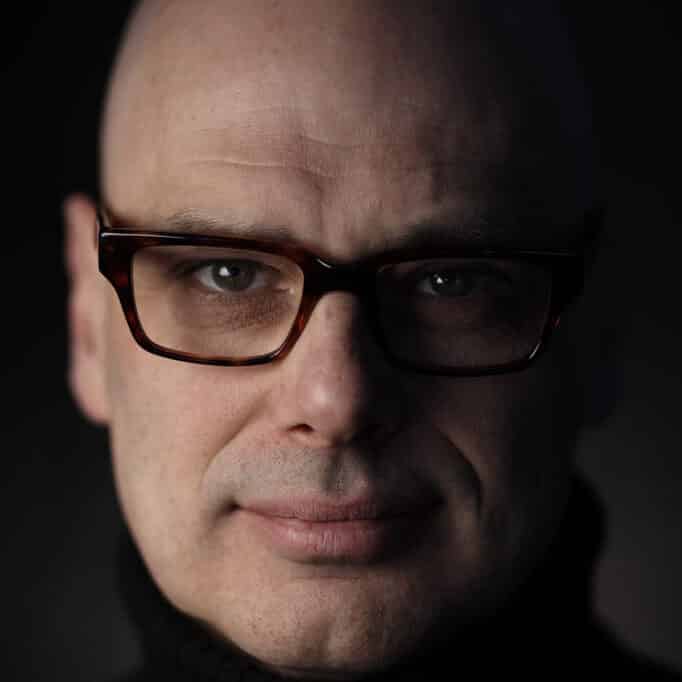 man wearing glasses facing camera