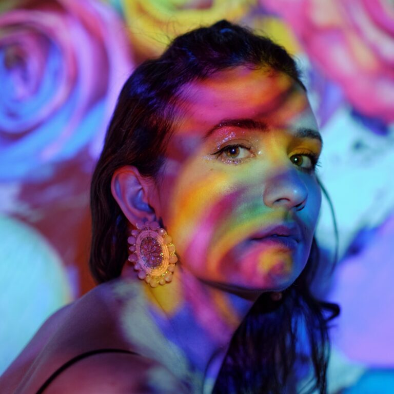 Woman with projected artwork on face