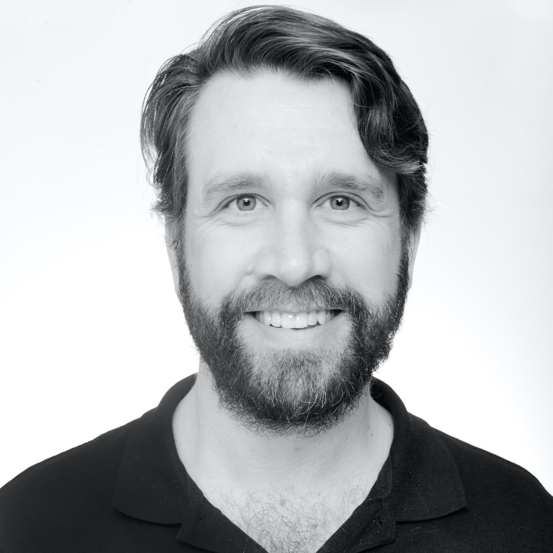 black and white photo of man with beard and mustache