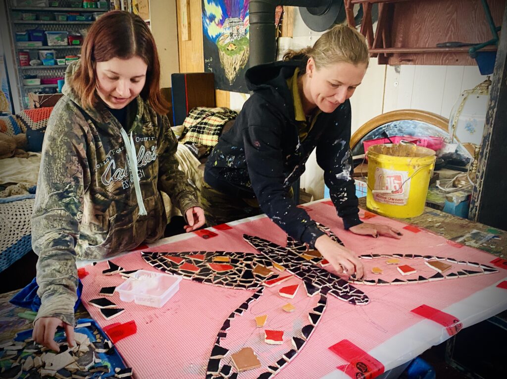 Kevela Jag and Annie Bergen working on mosaic art