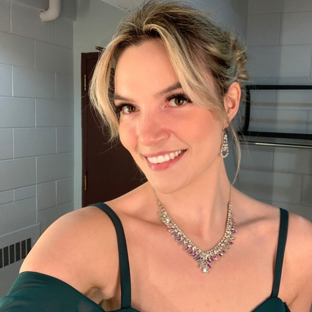 Woman in elegant clothing facing camera